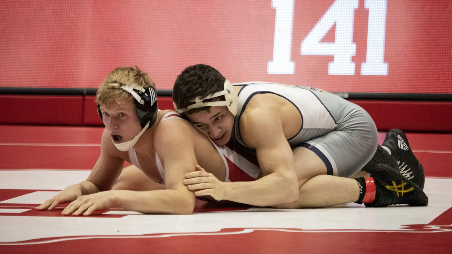 Then-freshman, now sophomore Kyle Luigs wrestles against junior Chris Debien on Feb. 24 in Wilkinson Hall. Luigs was arrested early Tuesday morning in Evansville, Indiana, while celebrating his 21st birthday.