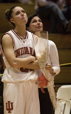 Senior guard Leah Enterline watches a video that her fellow teammates made for the graduating seniors for women’s basketball senior night.