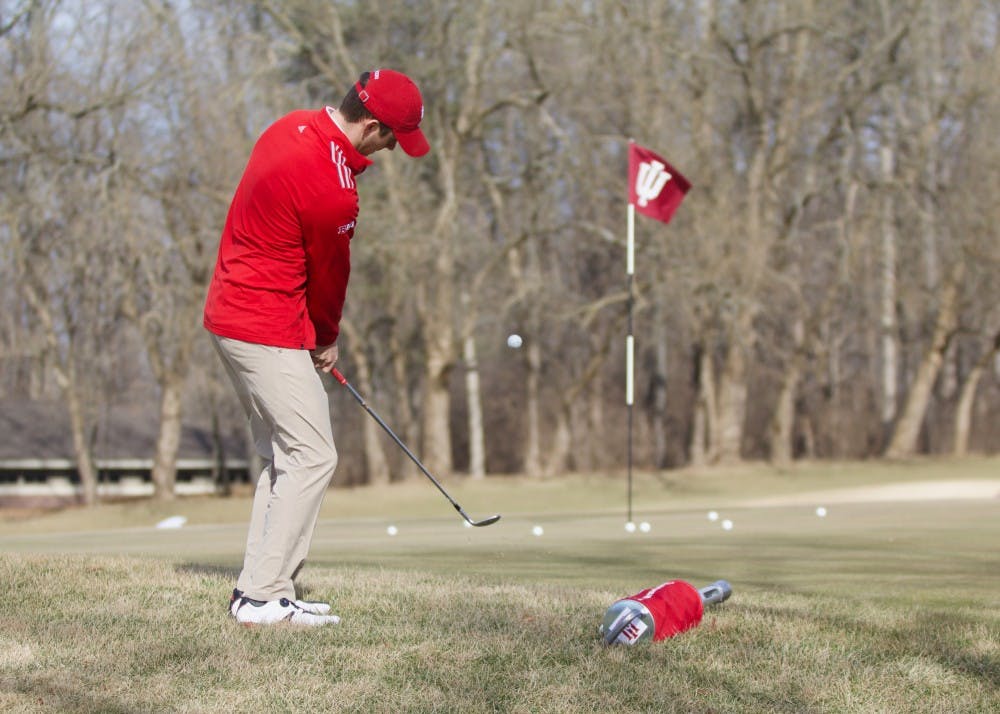 <p>Senior Christain Fairbanks practices chipping onto the green at the IU Golf Course during practice in Jan. 2018. The IU men's golf team finished fifth at last weekend's Big Ten Match Play tournament. &nbsp;</p>