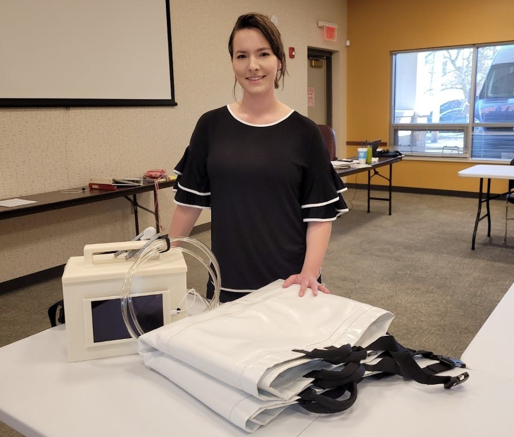 <p>IU alumnus Morgan Miller presents her device, the Morganleigh. The device helps patient care technicians turn patients on the bed in a safer and more comfortable way.<br/></p>