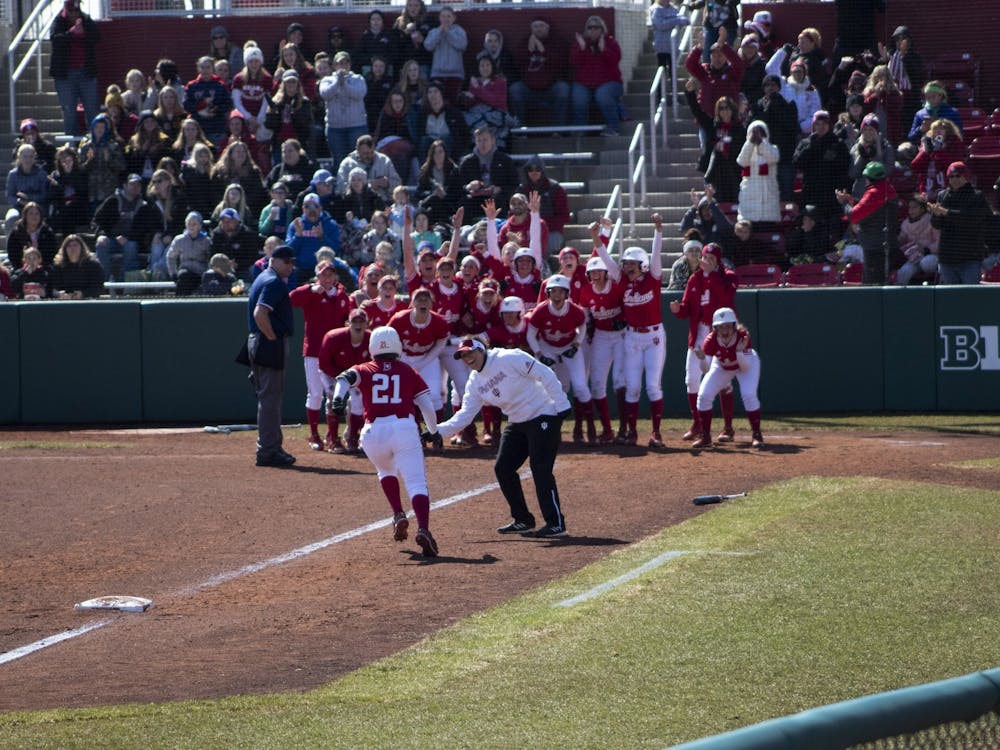 Then-freshman Juvia Davis is greeted March 17, 2019, by her teammates at home plate after hitting a grand slam for the Hoosiers at Andy Mohr Field. The Hoosiers lost to the Iowa Hawkeyes 2-1 in the 10th inning Sunday.