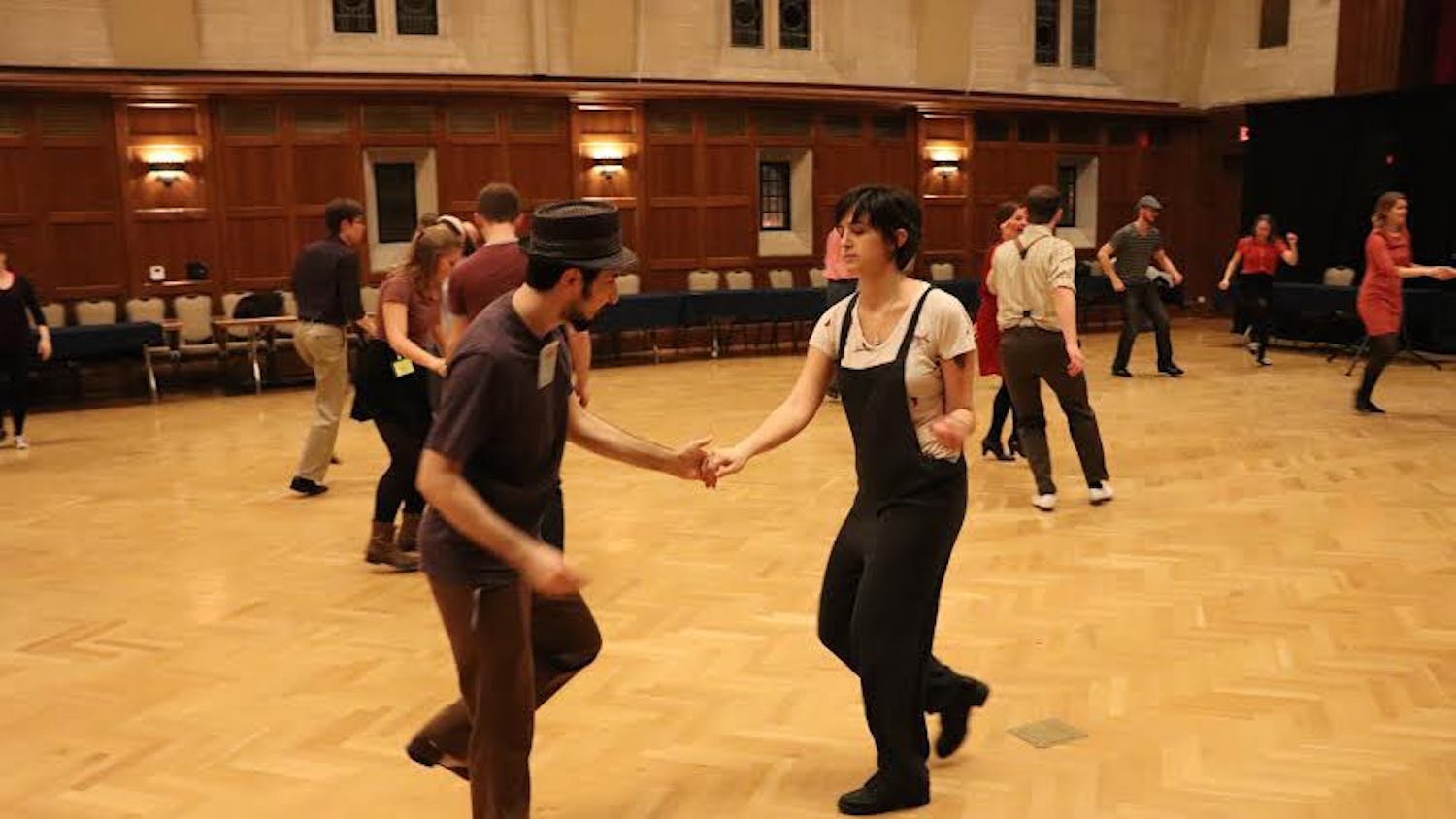 Erfan Sadeqi Azer dances with Jenna Richards during the Swing Dance Club callout meeting Monday. Azer, the Swing Dance Club's president, danced with students interested in the club.