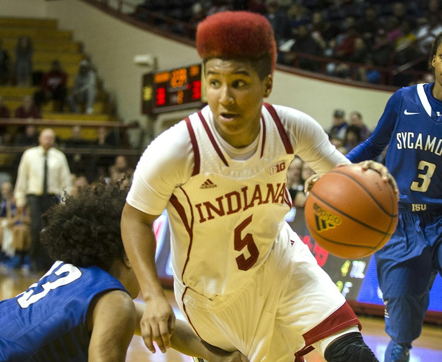 Sophomore guard Larryn Brooks dribbles in between two Indiana State defenders during overtime on Nov. 30 at Assembly Hall.