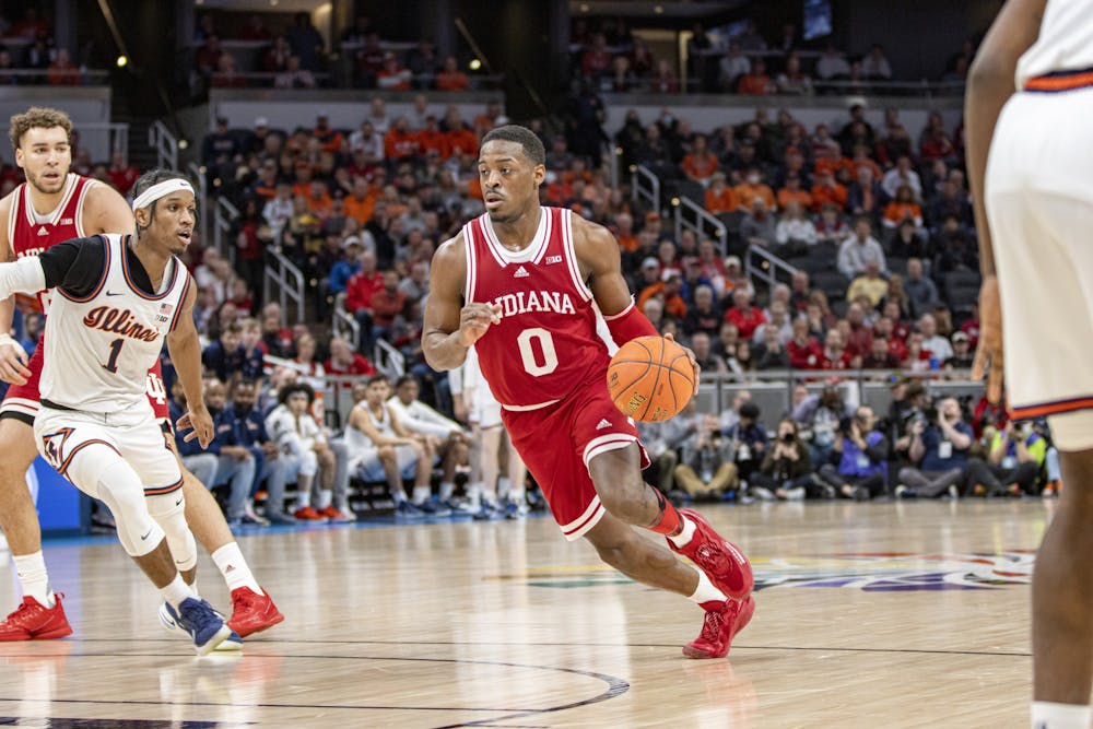 <p>Senior guard Xavier Johnson dribbles against Illinois in the Big Ten Tournament quarterfinals on March 11, 2022, at Gainbridge Fieldhouse. Johnson finished the game with 13 points, six assists and four rebounds.</p>
