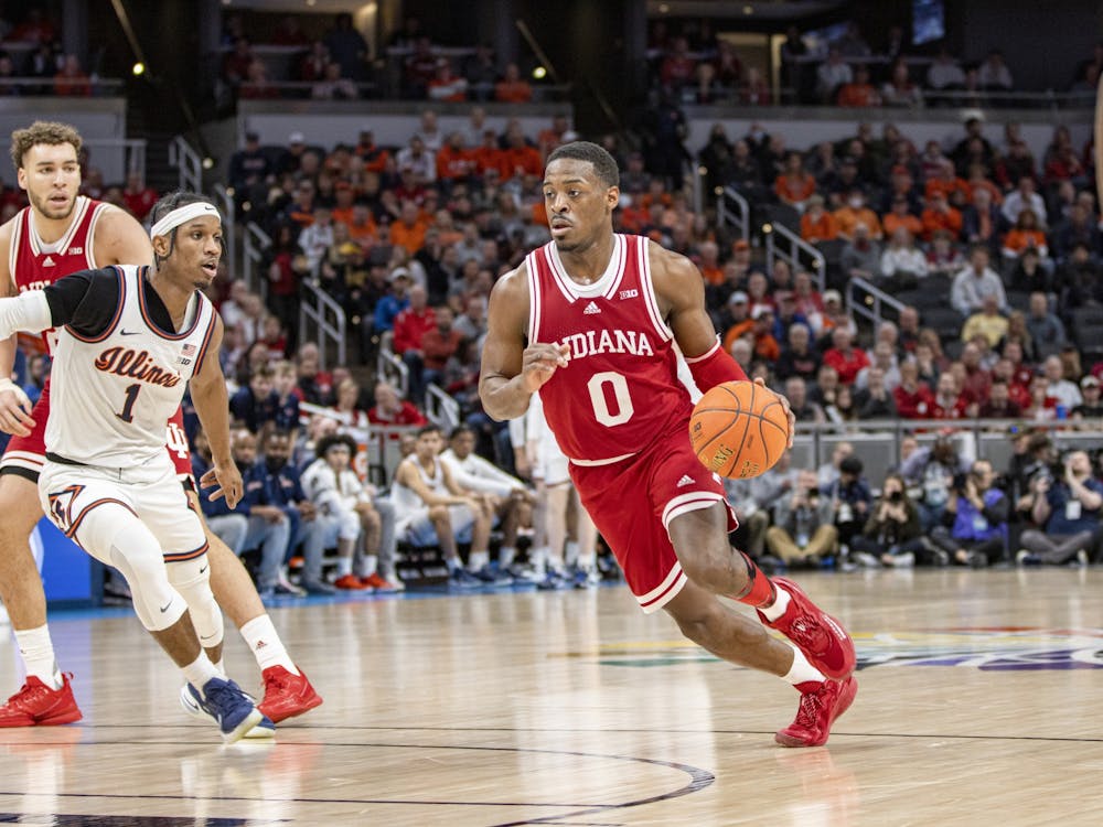 Senior guard Xavier Johnson dribbles against Illinois in the Big Ten Tournament quarterfinals on March 11, 2022, at Gainbridge Fieldhouse. Johnson finished the game with 13 points, six assists and four rebounds.