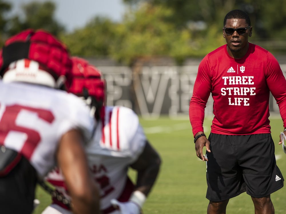 Indiana running backs coach Deland McCullough watches players Aug. 11, 2021, during fall camp at Memorial Stadium. McCullough was hired as the running backs coach at the University of Notre Dame on Monday.