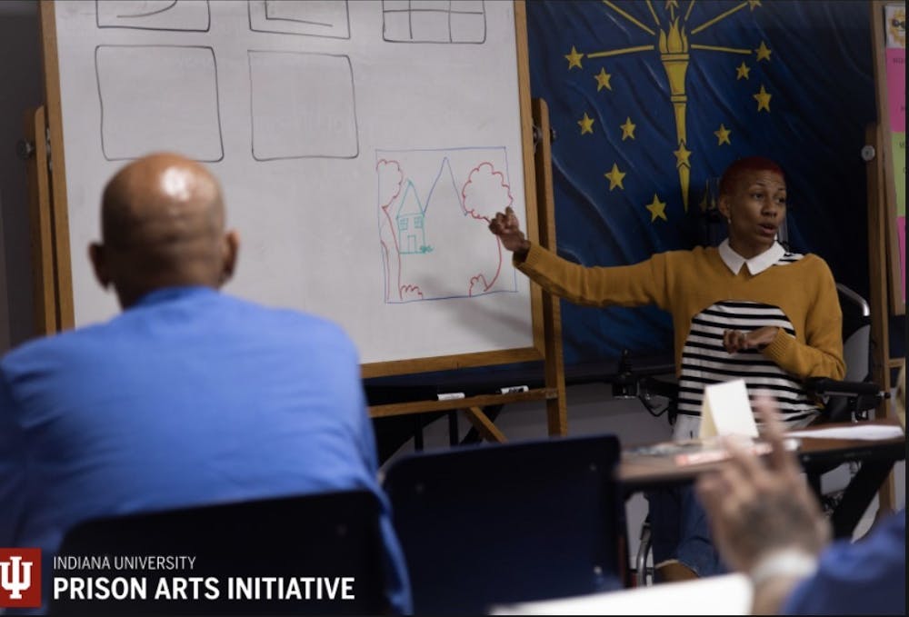 <p>A drawing instructor teaches students during an art class put on by the IU Prison Arts Initiative﻿. The initiative offers a 16-week, semester-long course for individuals in prison using IU instructors.</p>