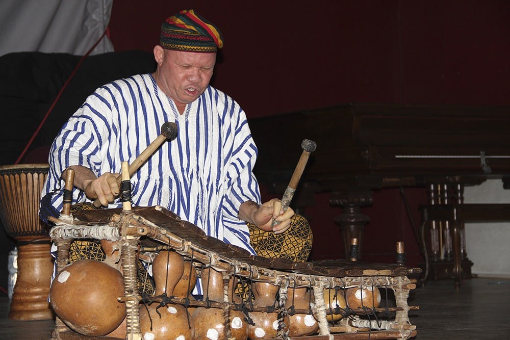 Leader of the Bernard Woma African Music and Dance troupe Bernard Woma performs during the Kilimanjaro Education Outreach's fundraiser Saturday evening at Harmony School gymnasium. The fundraiser raises money to support eduacation in East Africa.