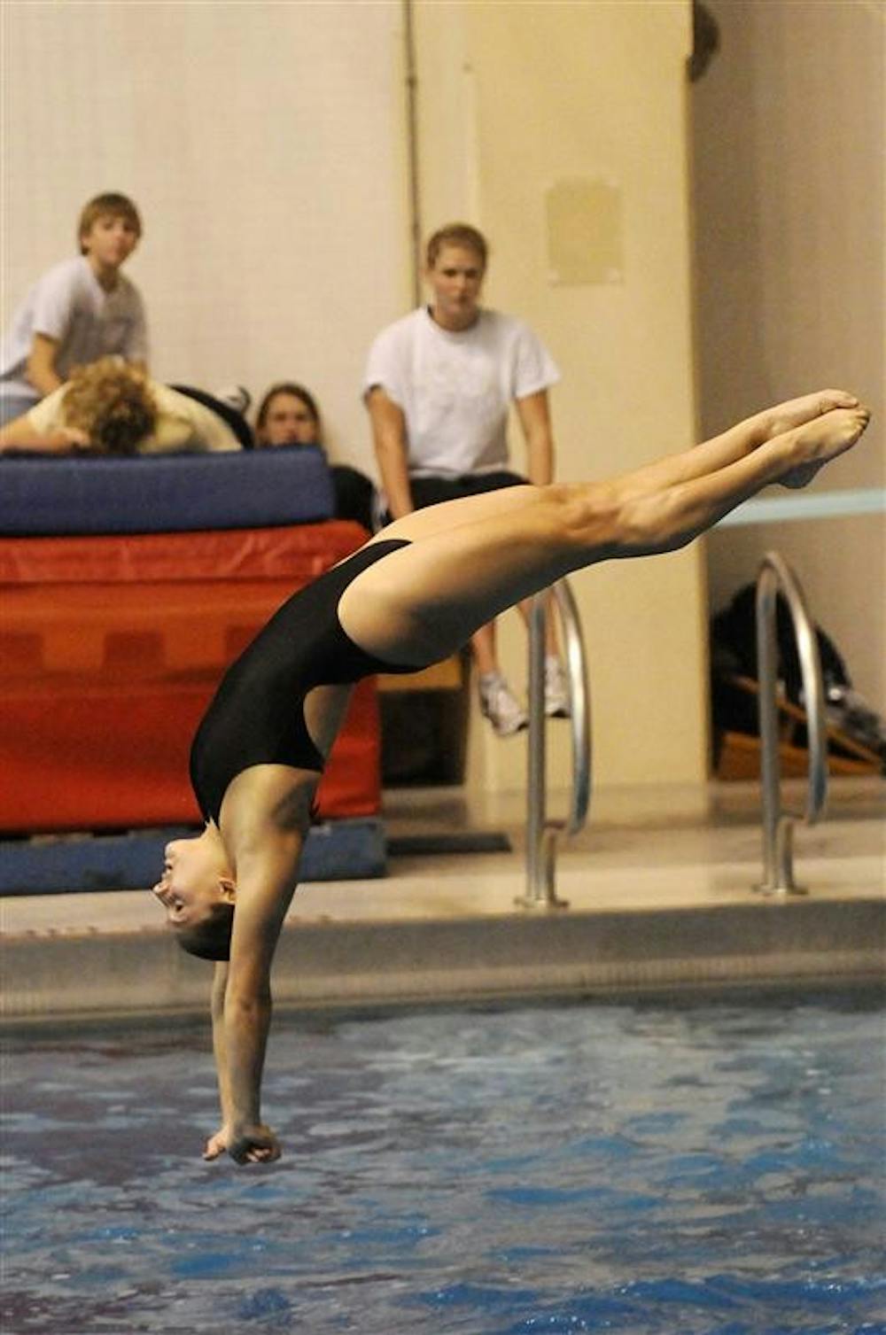 IU senior Christina Loukas prepares to hit the water during a dive in the three-meter springboard competition during a dual meet against Purdue on Saturday at the Counsilman-Billingsley Aquatic Center. Loukas won the event as the No. 13 Hoosiers won 210-159.