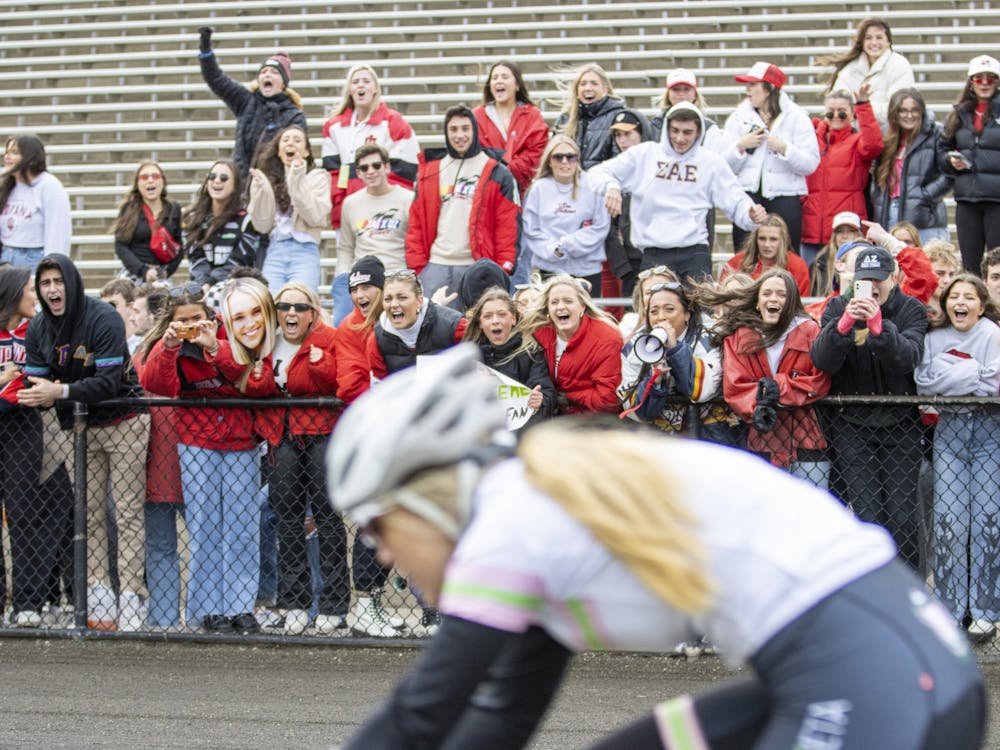 Fans cheer as Delta Zeta rides past during qualifications on March 26, 2022, at Bill Armstrong Stadium. Quals is the qualifying event for the Little 500.