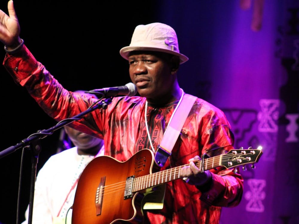 Mamadou Kelly sings one of his native Mali songs during the Lotus Music and Arts Festival kickoff concert Thursday, Sept. 27, at the Buskirk-Chumley Theater.