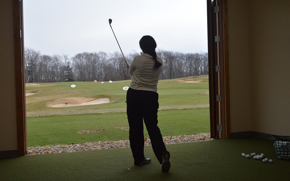 Senior Ana Sanjuan practiced her irons at IU's indoor training facility in early February. Sanjuan finished sixth place individually at the Westbrook Spring Invitational in Arizona over the weekend.