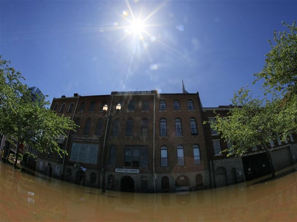 The sun shines over floodwater from the Cumberland River still covering a street in Nashville, Tenn., on Tuesday, May 4, 2010. The river began to recede Tuesday after being swollen by heavy rain and the flooding creeks that feed into it. (AP Photo/Mark Humphrey)
