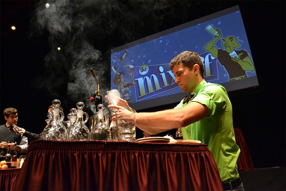 Nolan Hart, from Michael's uptown Cafe, preparing the drink called "Over the River and Through the Woods" during Mix-Off: Bloomington’s Ultimate Bartender Challenge on Oct. 17, 2014, hosted by Buskirk-Chumley Theater.