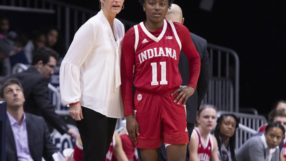IU women’s basketball head coach Teri Moren talks to redshirt freshman Chanel Wilson during a timeout Dec. 11 at Hinkle Fieldhouse in Indianapolis. No. 12 IU beat Butler University 64-53.