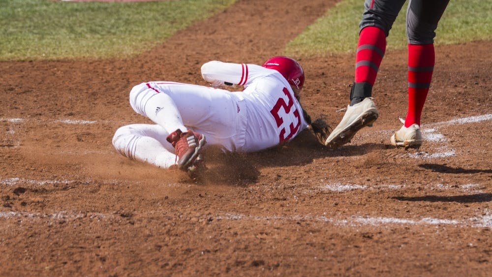 Freshman Gabbi Jenkins steals home plate from an error by Ohio State's catcher Sunday, March 25. IU will face WKU on March 27 at Andy Mohr Field.&nbsp;