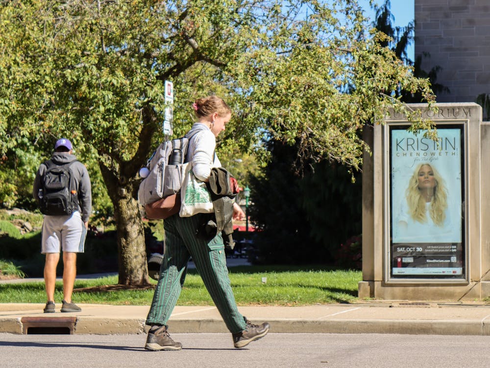Students walk by an advertisement Oct. 18, 2021, outside of the IU Auditorium. Kristen Chenoweth&#x27;s concert &quot;For the Girls&quot; will be performed at 8 p.m. Oct. 30, 2021, at the IU Auditorium. 