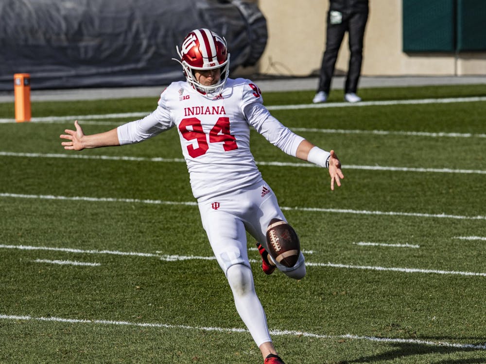 Grad student punter Haydon Whitehead punts the ball Nov. 14 in Spartan Stadium at East Lansing, Michigan. Whitehead was named Big Ten special teams player of the week Monday.