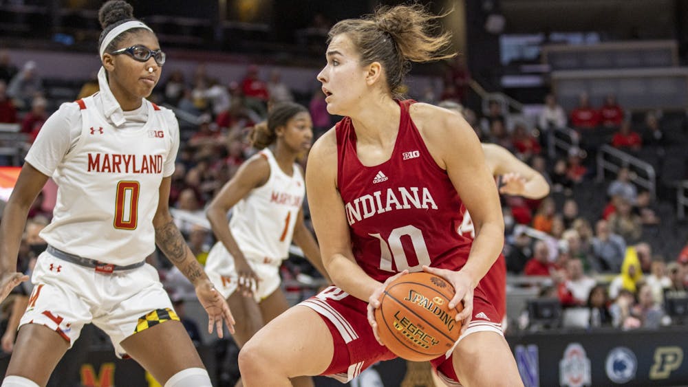Senior forward Aleksa Gulbe dribbles during Indiana&#x27;s Big Ten Tournament game against Maryland on March 4, 2022, at Gainbridge Fieldhouse in Indianapolis. Indiana beat Maryland 62-51 and will advance to the semifinals of the Big Ten Tournament.