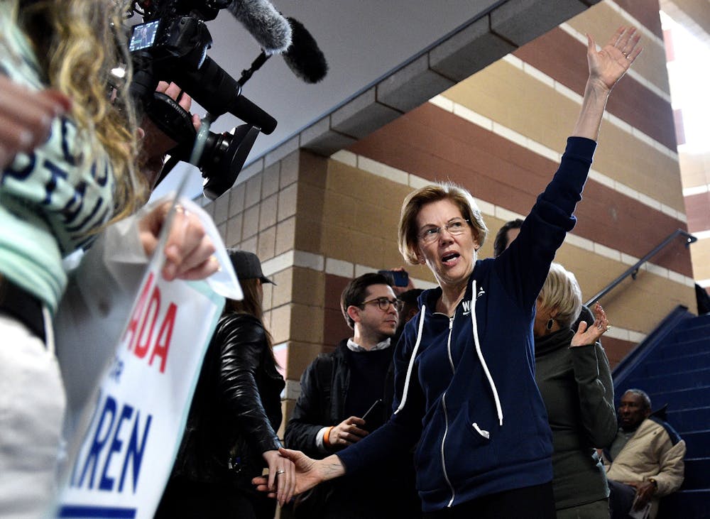 <p>Democratic presidential candidate Sen. Elizabeth Warren, D-Mass., waves to caucus goers Feb. 22 at Coronado High School.</p>