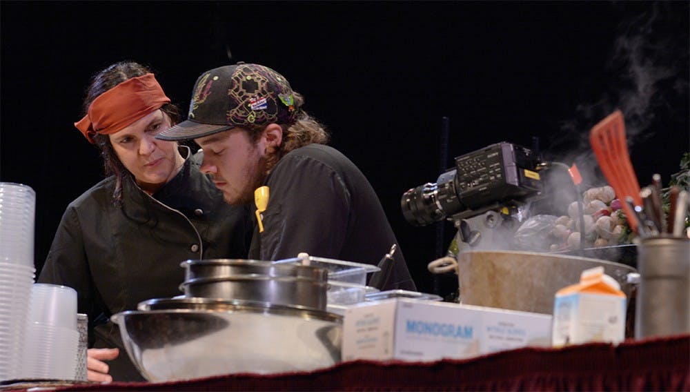 Jason Damon and Erika Yochum , contenders from Feast Bakery Cafe, talk about their strategy before the contest starts. Damon and his sous chef won the contest.