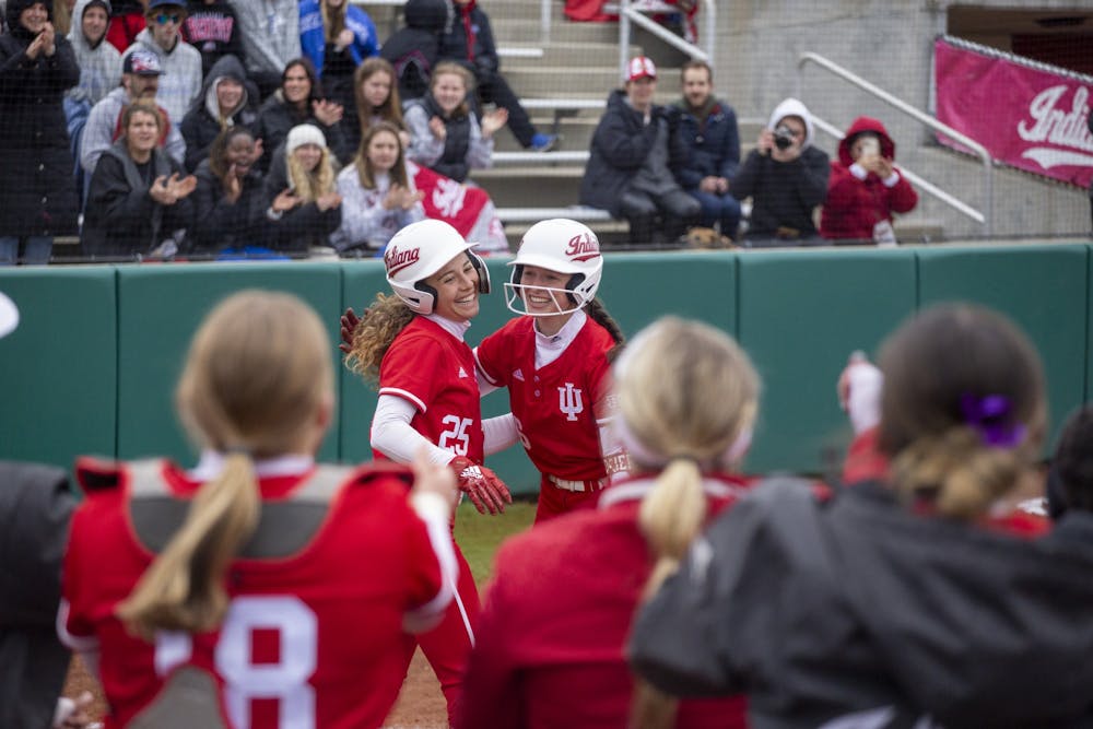 Senior Cora Bassett hugs junior Brooke Benson after a home run April 1, 2023, at Andy Mohr Field. Indiana beat Ohio State for its 19th straight win.