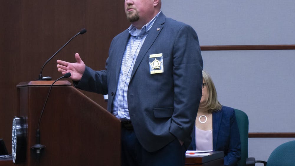 Paul Post, a senior police officer and president of the local chapter of the Fraternal Order of Police, speaks during a city council meeting Dec. 4 at the Showers Building. A vote at the meeting settled almost two years of negotiations about officer pay. 