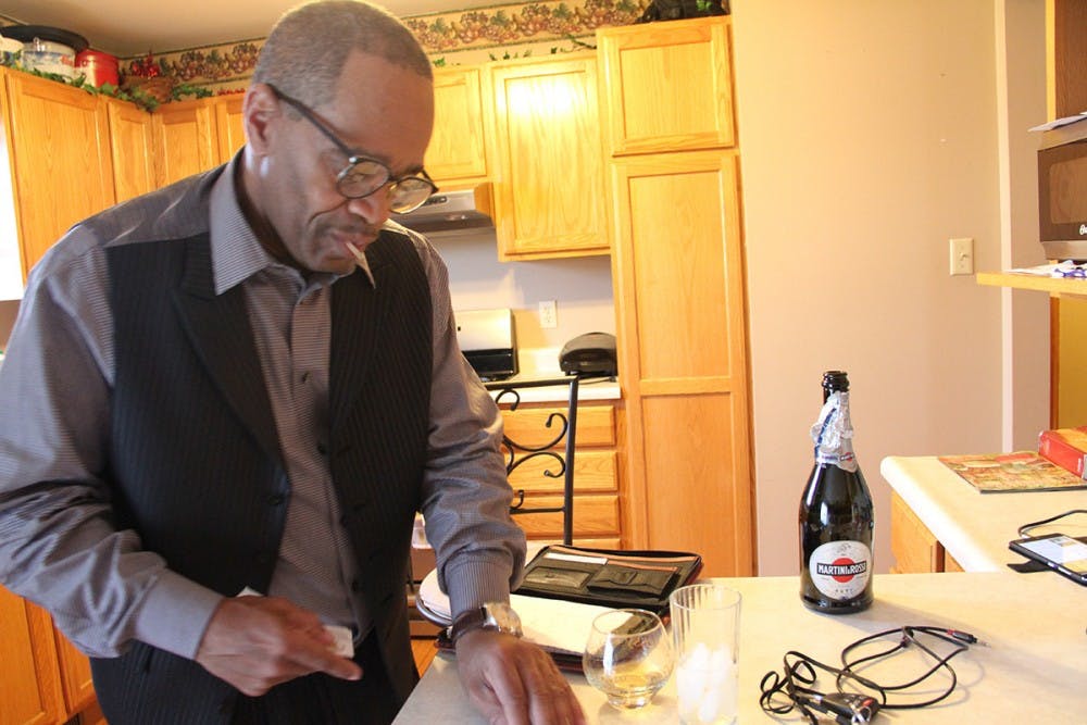 Darryl Pinkins relaxes in his kitchen on a Sunday morning after having breakfast with his son at Cracker Barrel. He shares the house with his nephew, who is a firefighter and is gone for days at a time. Darryl says it's like living alone.