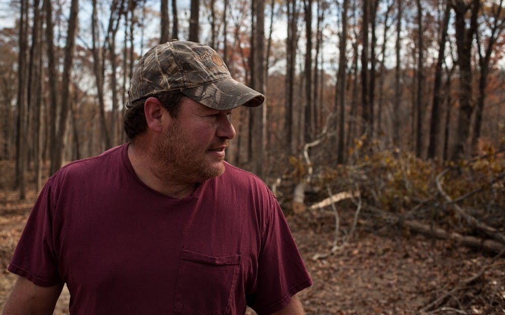 Kevin Pool looks around for a moment at a logging site that he logged this fall near Snoddy Road in Bloomington, Indiana on Nov. 17, 2016. Pool has been logging for a majority of his life, working with his family at Helmsburg Sawmill in Helmsburg, Indiana.