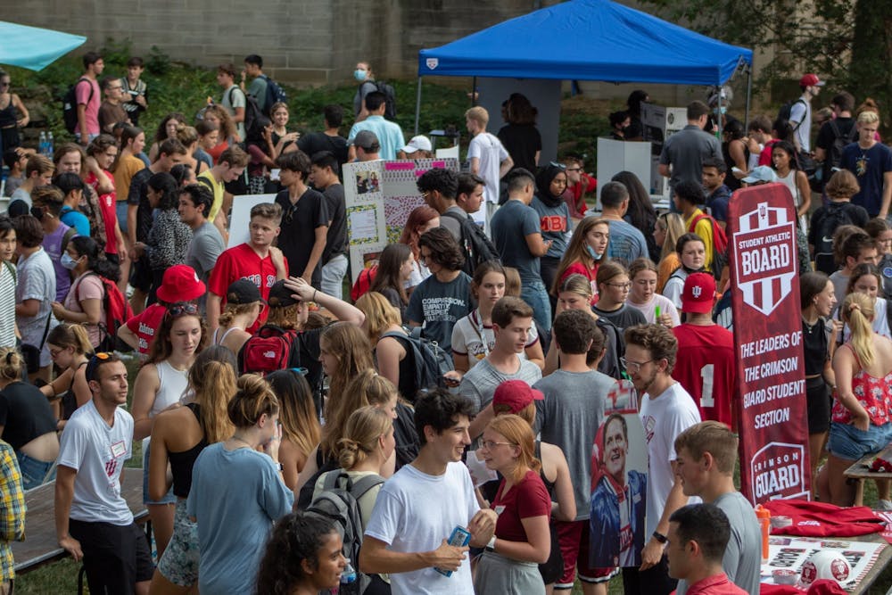 <p>S﻿tudents wade through the crowds at the student involvement fair Aug. 26, 2021, in Dunn Meadow. The student involvement fair offers students the ability to view different clubs and organization at IU. </p>