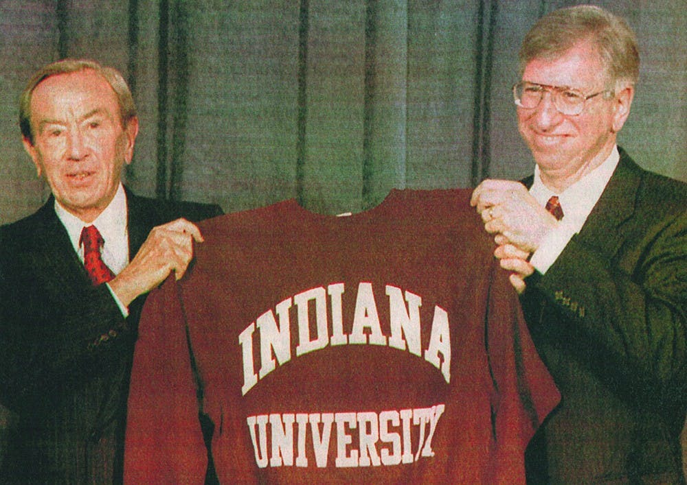 U.S. Secretary of State Warren Christopher shows off the IU sweatshirt given to him by University President Myles Brand following Christopher's speech on the future of American policy March 29, 1995 in the Indiana Memorial Union's Alumni Hall.
