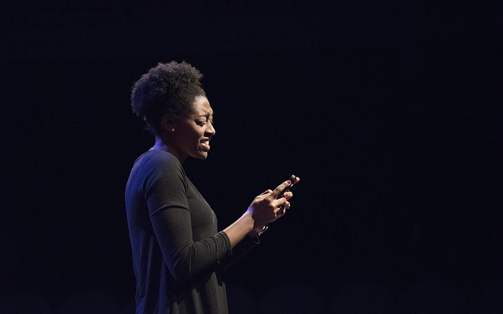 <p>Former student Keilah Johnson performs the &quot;To Do List After Break-Up&quot; from the Rupi Kaur&#x27;s poetry book &quot;Milk and Honey&quot; March 2, 2017, at the Lee Norvelle Theatre and Drama Center. </p>
