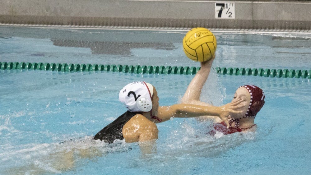 California State University junior utility Jennalyn Barthels blocks junior driver Emily Powell’s face March 3, 2019, in Counsilman Billingsley Aquatics Center. The team had three consecutive wins in its home opener this weekend. 