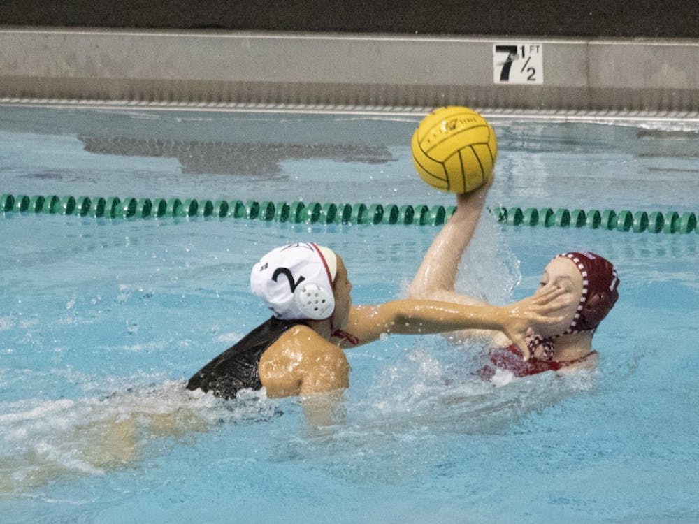 California State University junior utility Jennalyn Barthels blocks junior driver Emily Powell’s face March 3, 2019, in Counsilman Billingsley Aquatics Center. The team had three consecutive wins in its home opener this weekend. 