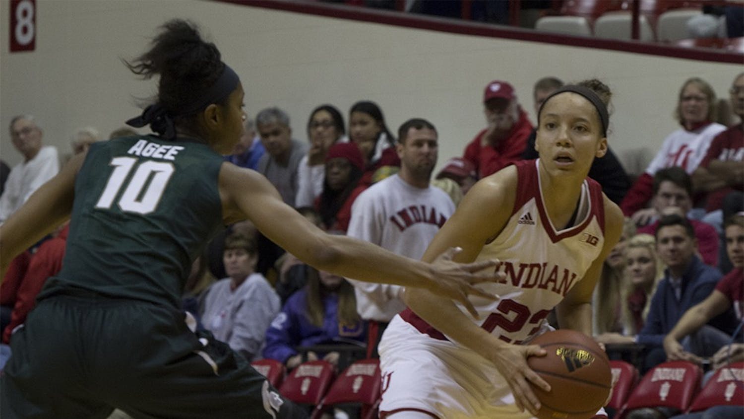 Junior guard Alexis Gassion looks to move around a Michigan State player on Wednesday night at Assembly Hall. The Hoosiers won the game 85-61.