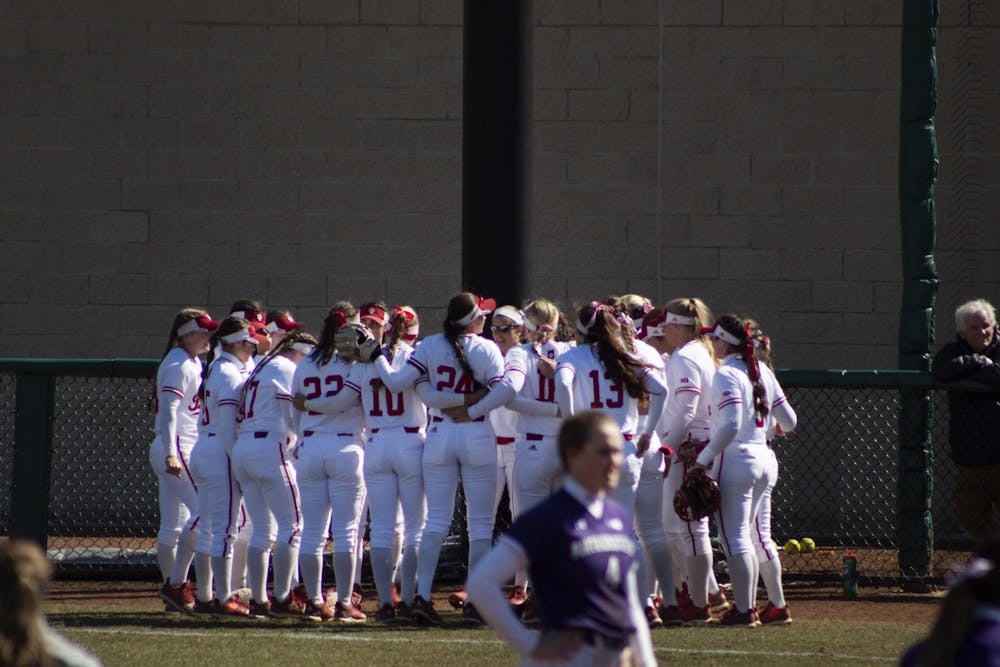 <p>The IU softball team huddles before a game March 16, 2019. The Hoosiers will play Michigan on Friday at home. </p>