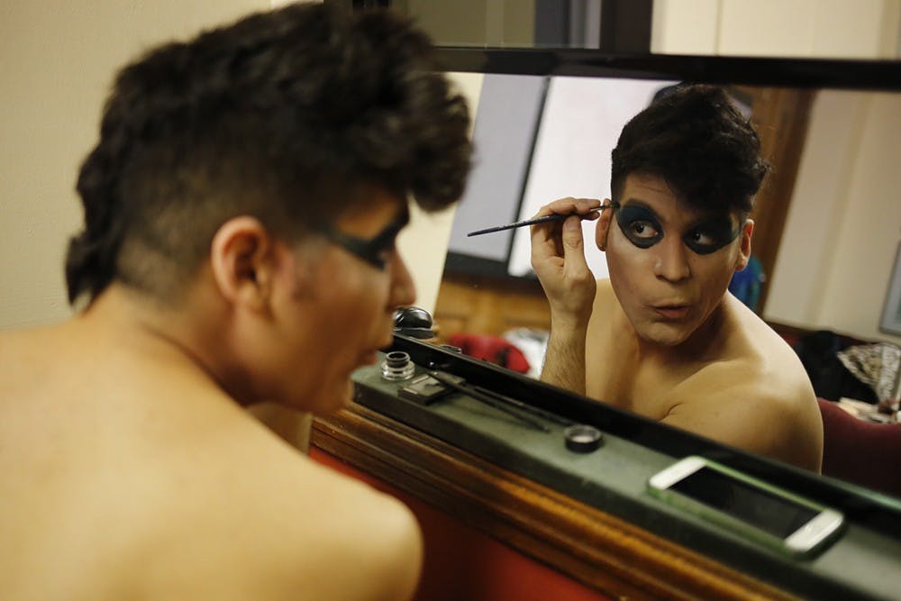 Titanium Peron prepares for his performance at the Condom Fashion Show at the Indiana Memorial Union on Thursday. The fashion show aimed to promote sexual health awareness and safe-sex practices.