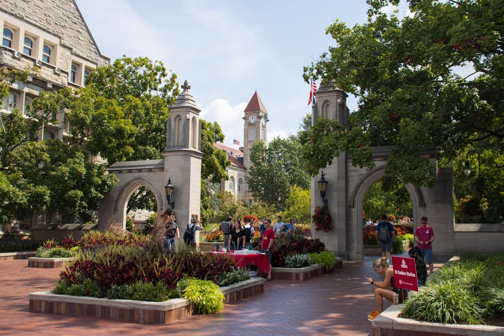 <p>Students walking past the Sample Gates are pictured. </p>
