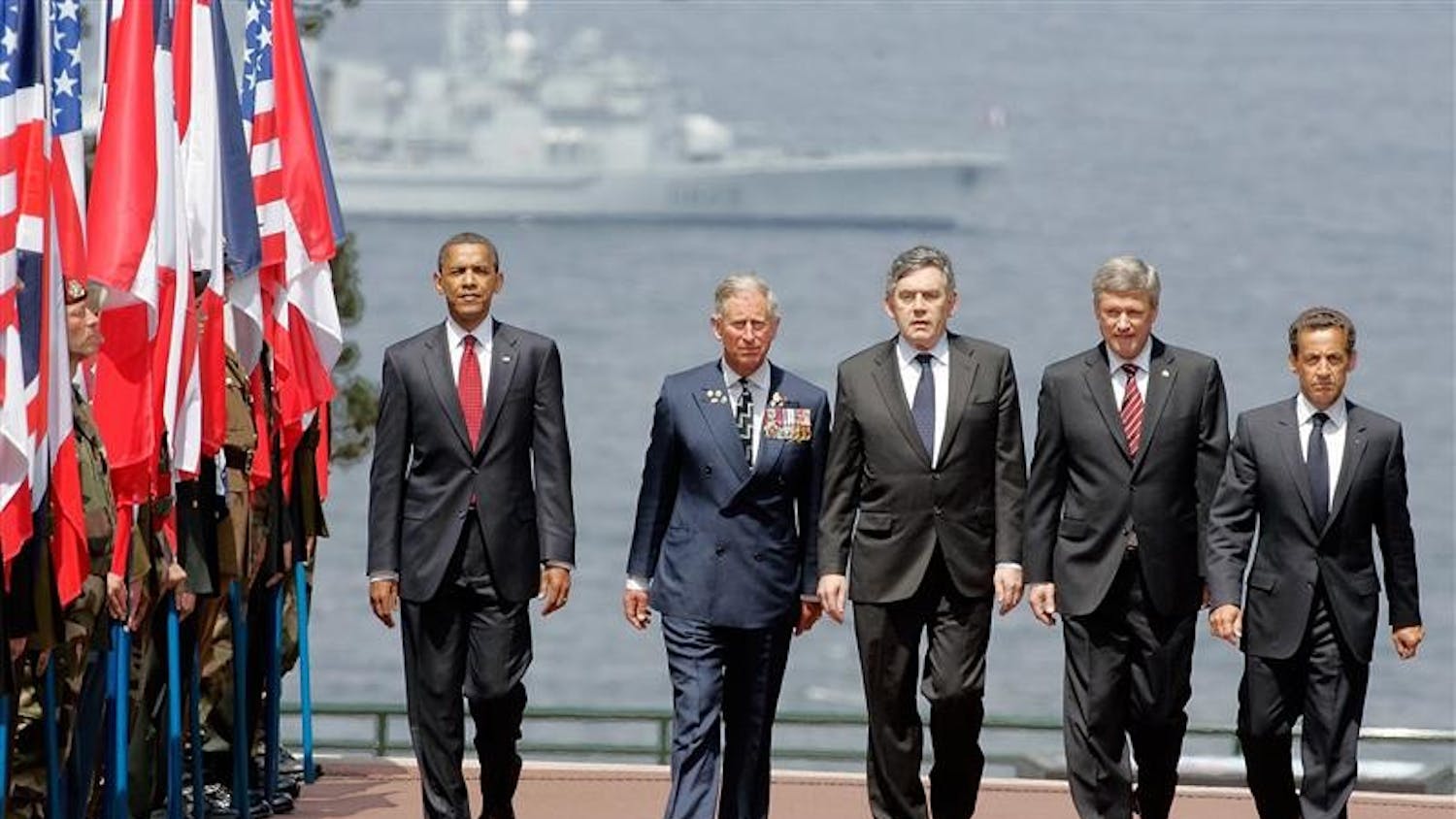 From left, U.S. President Barack Obama, Britain's Prince Charles, British Prime Minister Gordon Brown, Canadian Prime Minister Stephen Harper, and French President Nicolas Sarkozy arrive at the American Cemetery at Colleville-Sur -Mer, near Caen, Western France, Saturday, June 6, 2009 to attend the 65th Anniversary of the D-day landings in Normandy. 