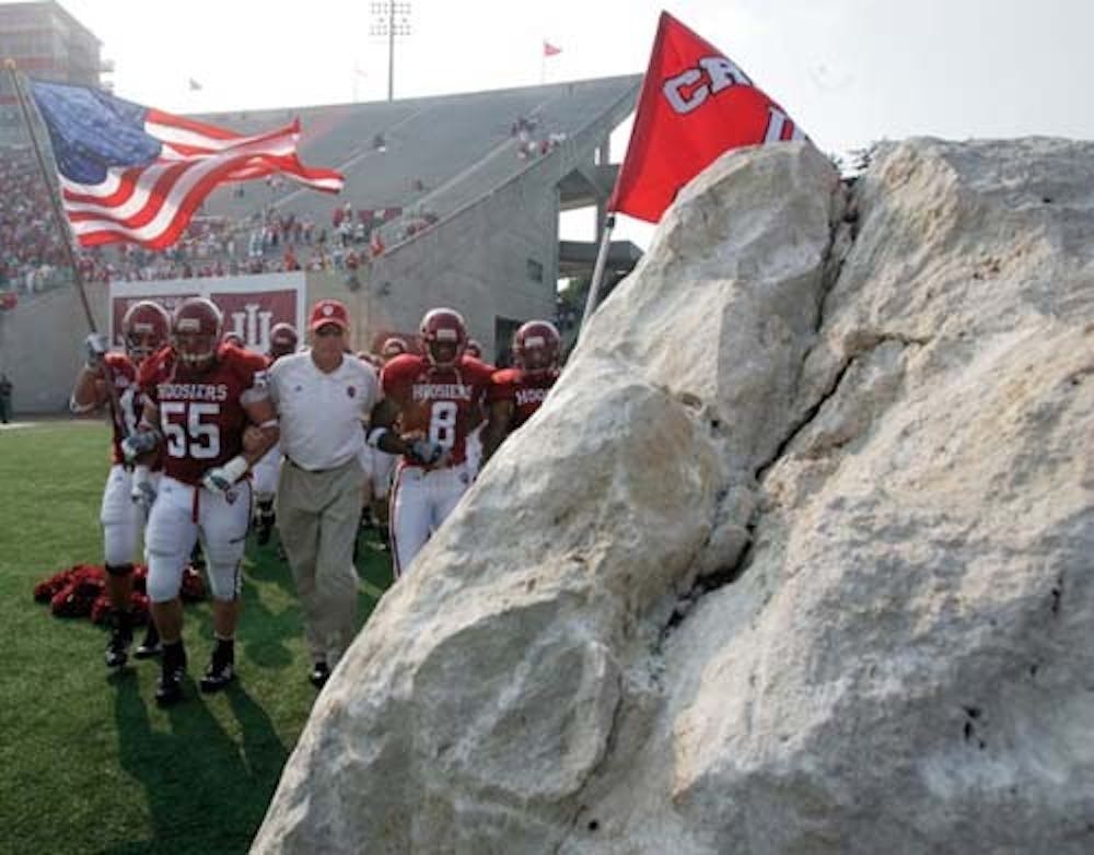 File Photo
The team enters the field to touch the rock during a home football game.