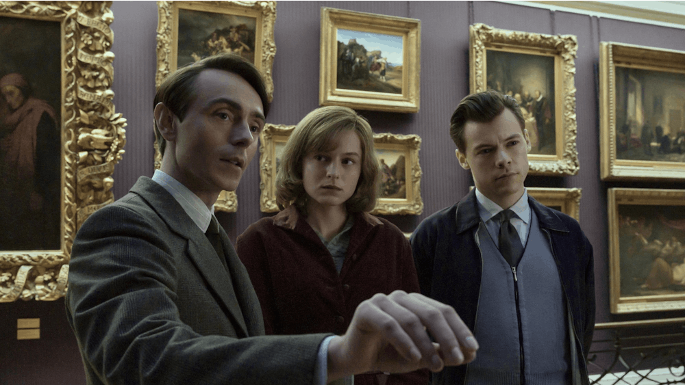 David Dawson, Emma Corrin and Harry Styles are seen starring in the 2022 film &quot;My Policeman.&quot;﻿