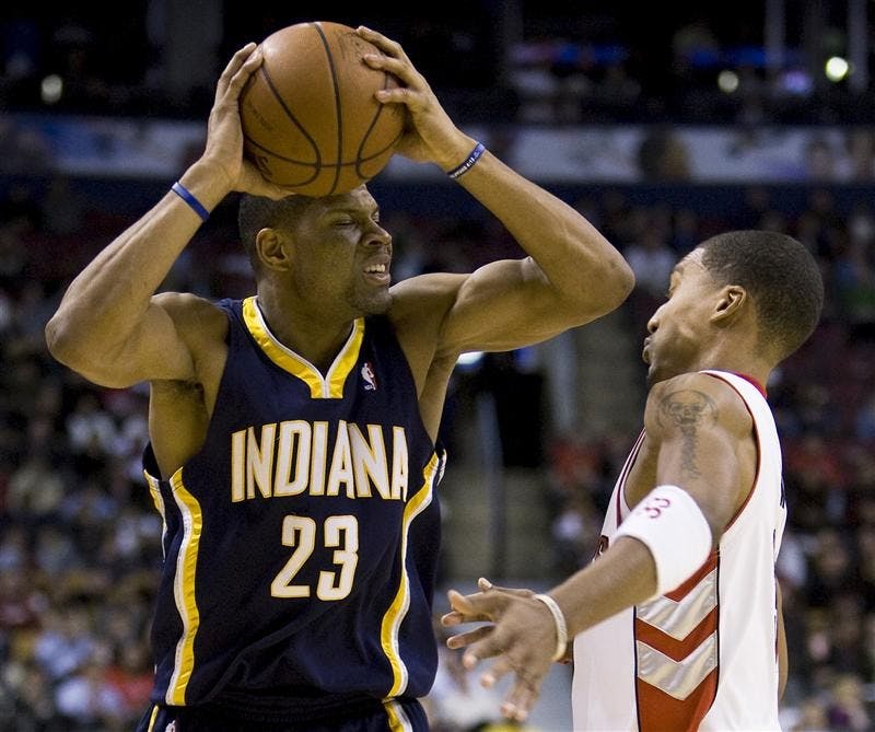 Toronto Raptors' Jamario Moon, right, takes an elbow to the face from Indiana Pacers' Stephen Graham during first half Wednesday evening in Toronto.