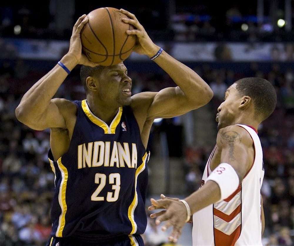 Toronto Raptors' Jamario Moon, right, takes an elbow to the face from Indiana Pacers' Stephen Graham during first half Wednesday evening in Toronto.