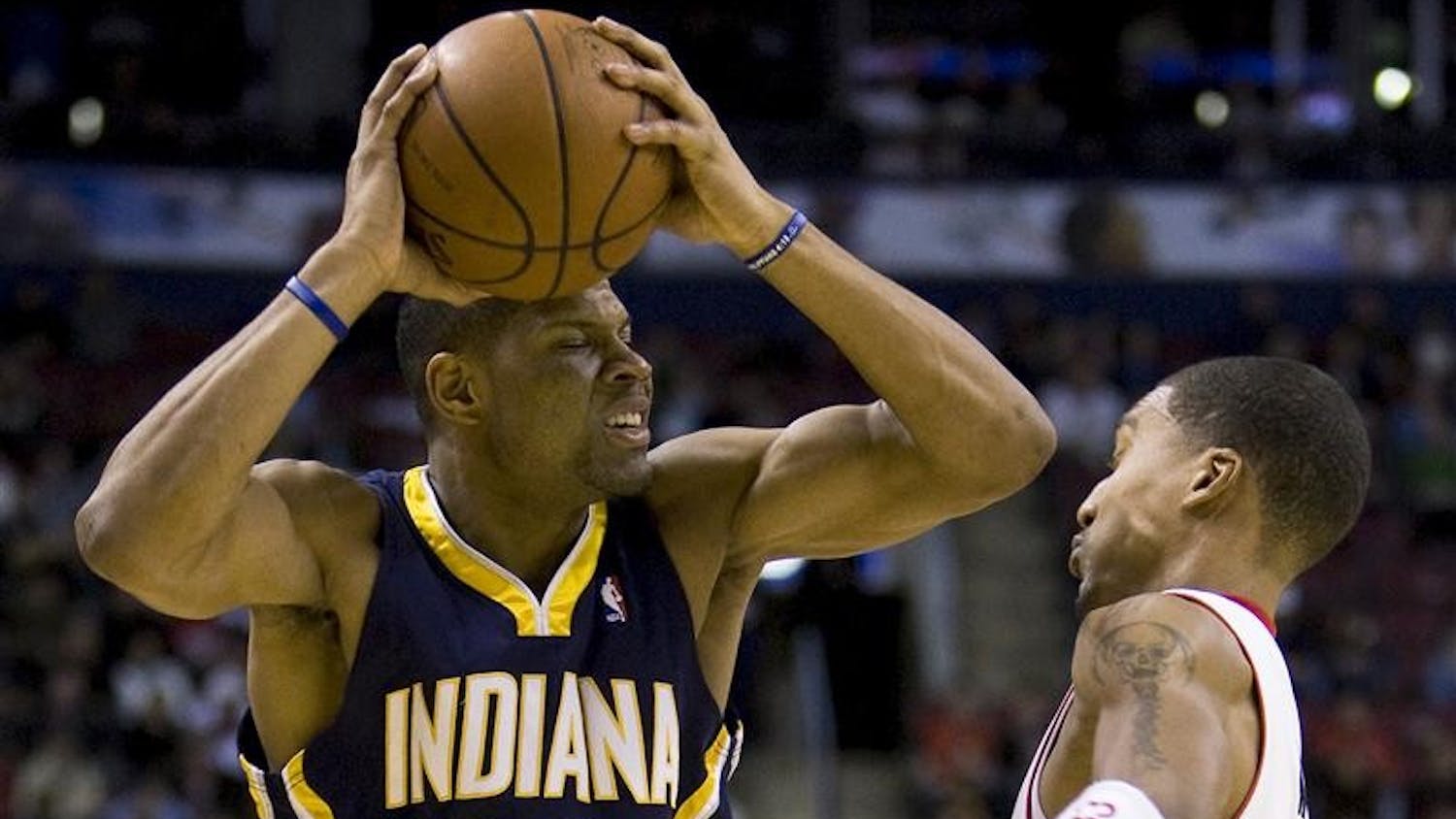 Toronto Raptors' Jamario Moon, right, takes an elbow to the face from Indiana Pacers' Stephen Graham during first half Wednesday evening in Toronto.