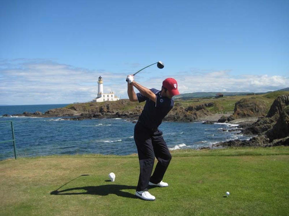 U golfer Jorge Campillo tees off over rocks and water at Ailsa Golf Course during the 2008 British Amateur Championships in Turnberry, Scotland. Campillo followed up his second place finish at the NCAA Championships by tying nine other players at five over par, the seventh highest score, at one of Europe's top amateur events.