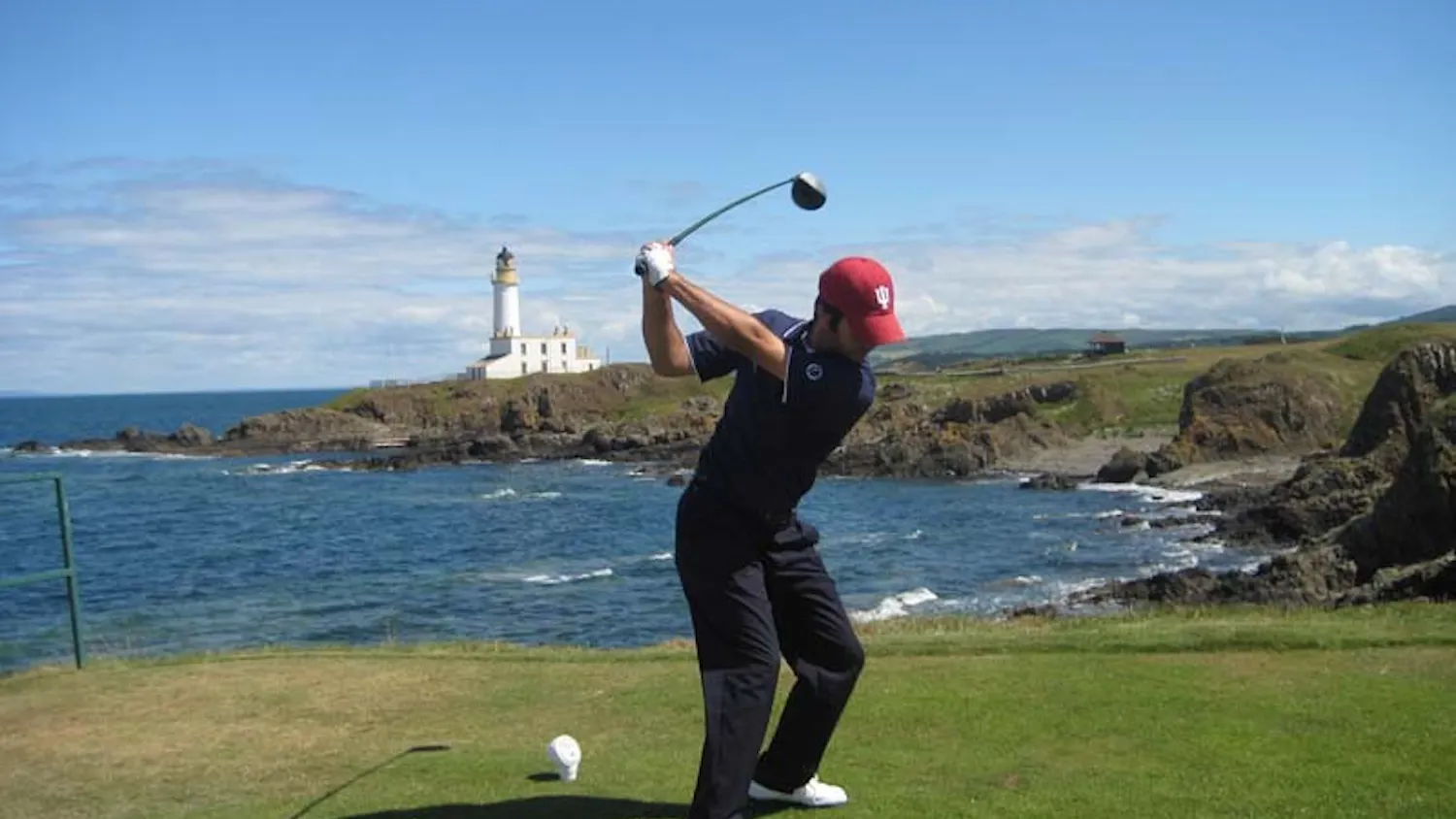 U golfer Jorge Campillo tees off over rocks and water at Ailsa Golf Course during the 2008 British Amateur Championships in Turnberry, Scotland. Campillo followed up his second place finish at the NCAA Championships by tying nine other players at five over par, the seventh highest score, at one of Europe's top amateur events.