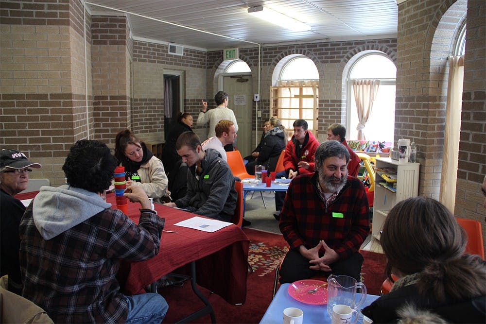 Volunteers meet at the Islamic Center of Bloomington to prepare for a day of weatherizing houses. The project was funded with a grant from the Bloomington Martin Luther King Jr. Commission.
