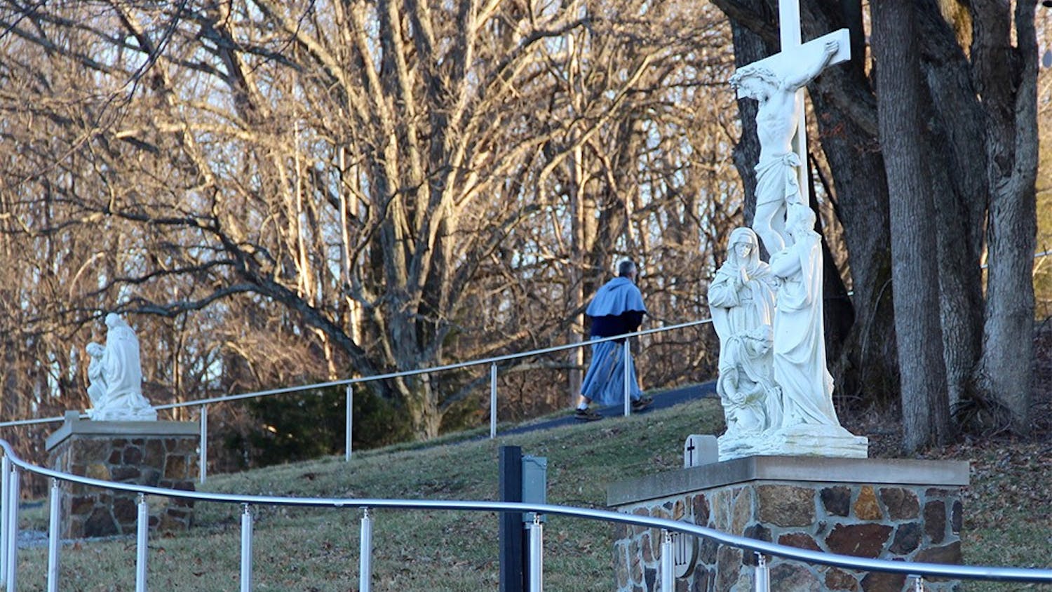 Father Elias Mary Millswalks the stations of the cross at the Mother of the Redeemer Retreat Center. Milswalks lives at the Mother of the Redeemer Retreat Center on Bloomington's west side, where he leads mass and various processionals around the property's prayer paths. The Mother of the Redeemer Retreat Center is considered "holy" ground on Bloomington's west side. 