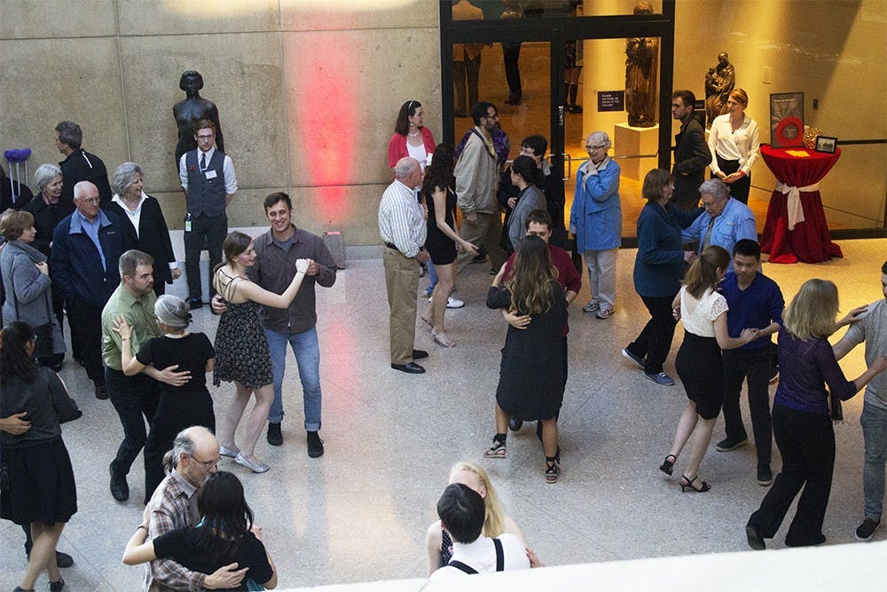 A large crowd learns how to swing dance from the IU Swing Dance Club on Tuesday at the 75th celebration of the IU Art Museum. All types of art were represented at this event. 
