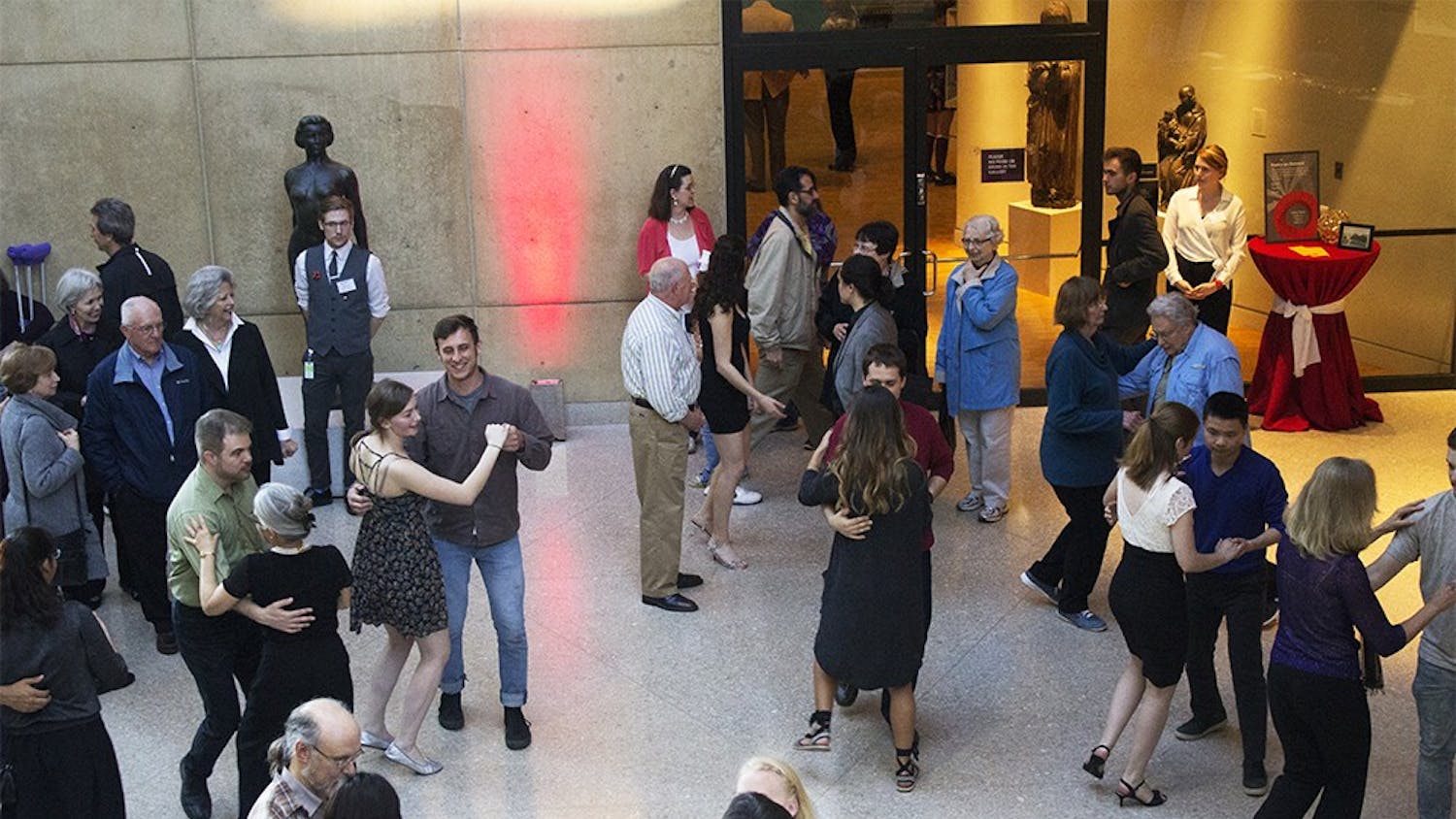 A large crowd learns how to swing dance from the IU Swing Dance Club on Tuesday at the 75th celebration of the IU Art Museum. All types of art were represented at this event.